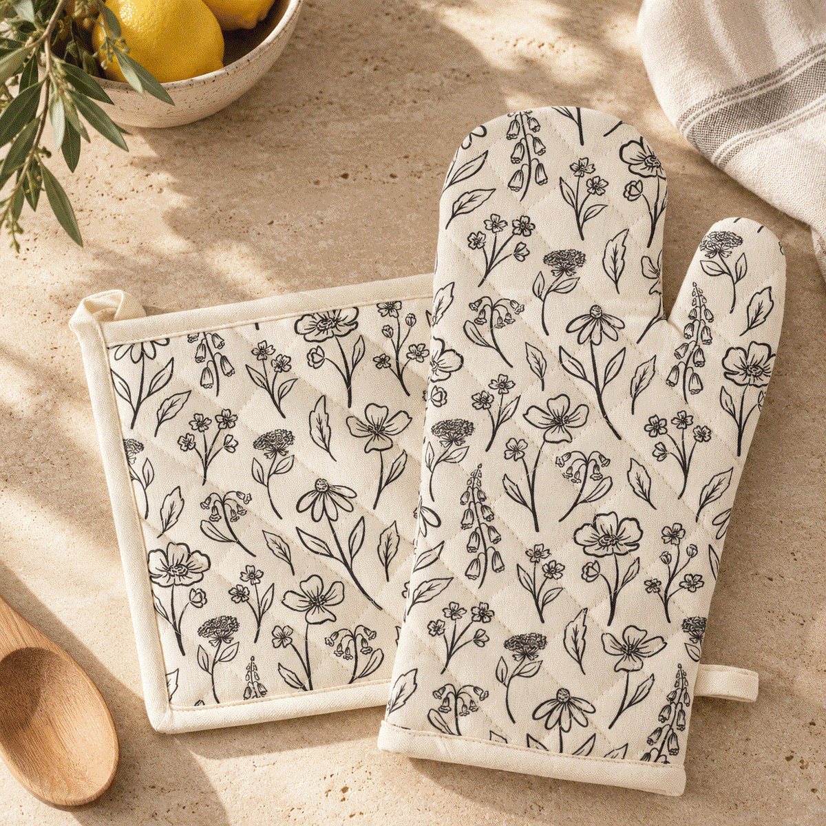 Beige Floral Oven Mitt set in cream cotton with black line-drawn wildflowers, quilted mitt and matching square pot holder