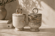 Calista Candle Pot in cream and gray marbled concrete, with rounded vessels, loop handles, and pedestal bases