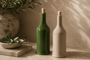 Handmade Stoneware Olive Oil Dispenser in glossy olive green and matte beige, each with a classic bottle shape and cork stopper