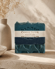 Southern Gent Artisan Soap in two deep teal handmade bars with a cream Center Street Soap Co. label and embossed details