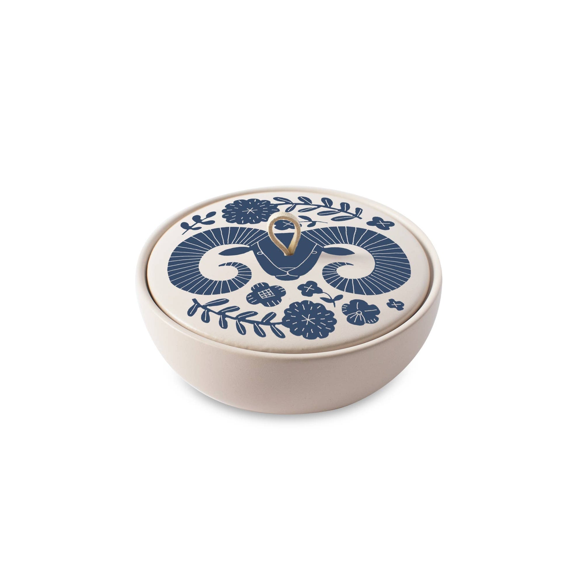 The Rooted Home ceramic Aries zodiac trinket box with blue floral design, matte finish, and faux suede loop handle.