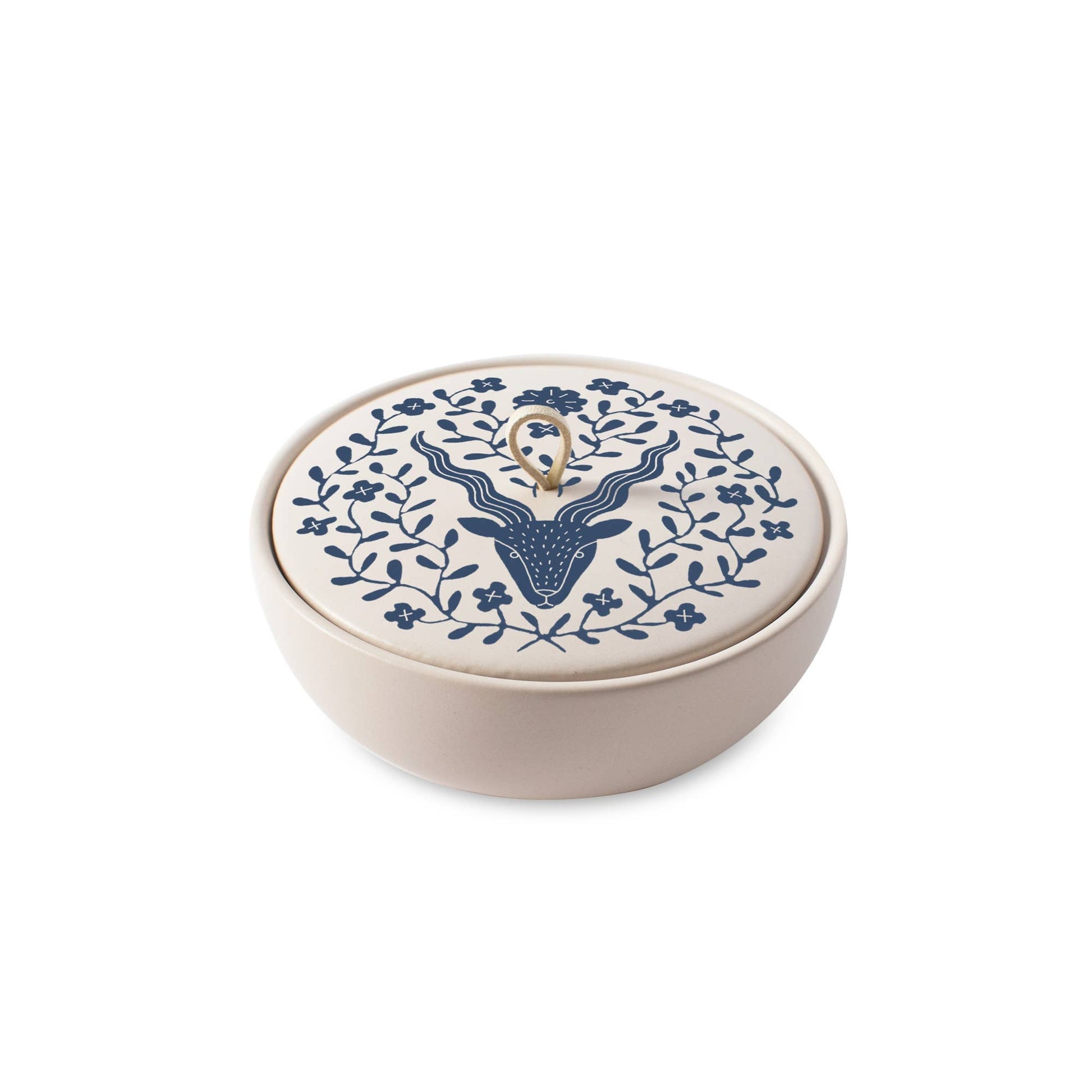 The Rooted Home ceramic trinket box with a matte finish, featuring a blue Capricorn zodiac design and suede loop.
