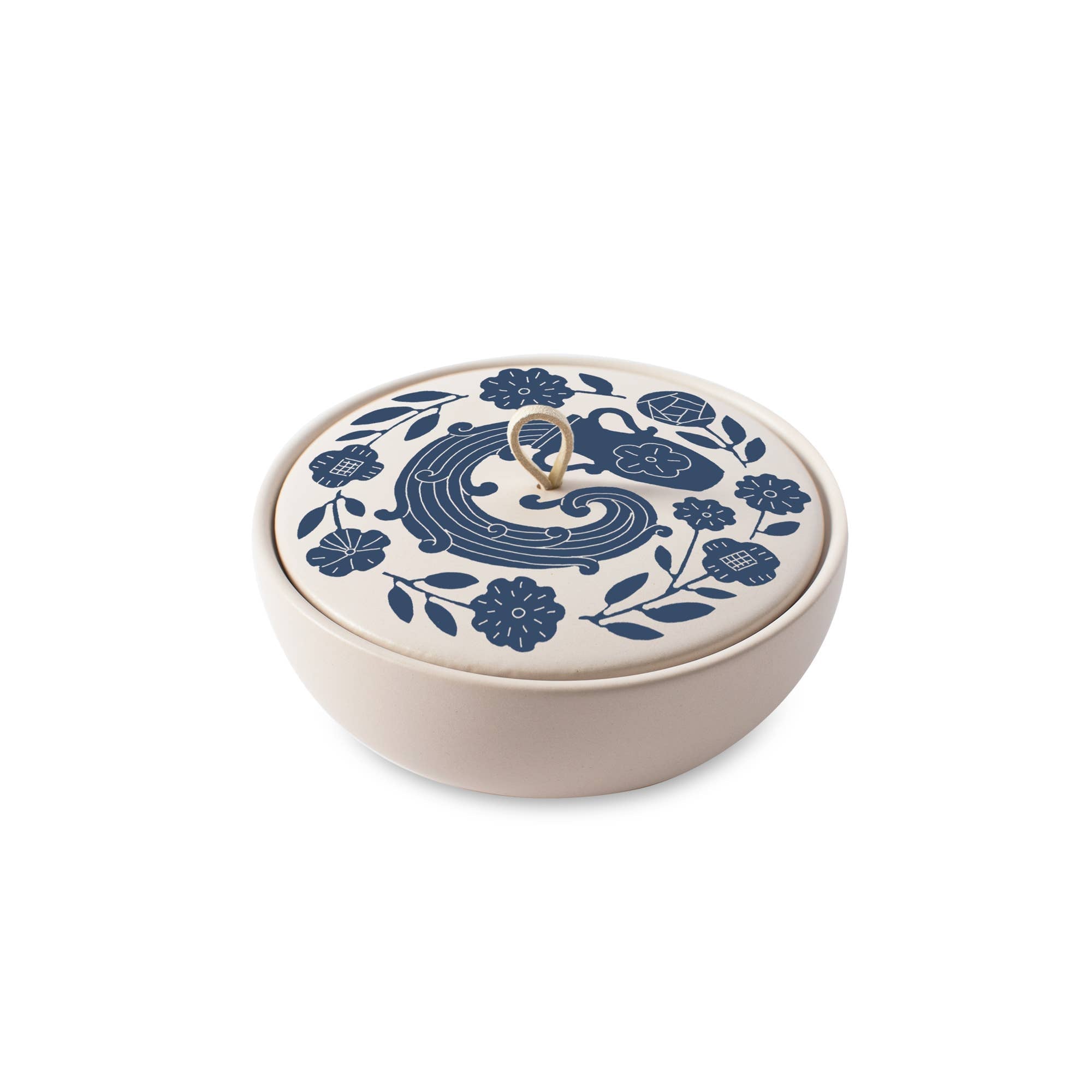 The Rooted Home ceramic zodiac trinket box with a matte finish, blue floral design, and a faux suede loop handle.