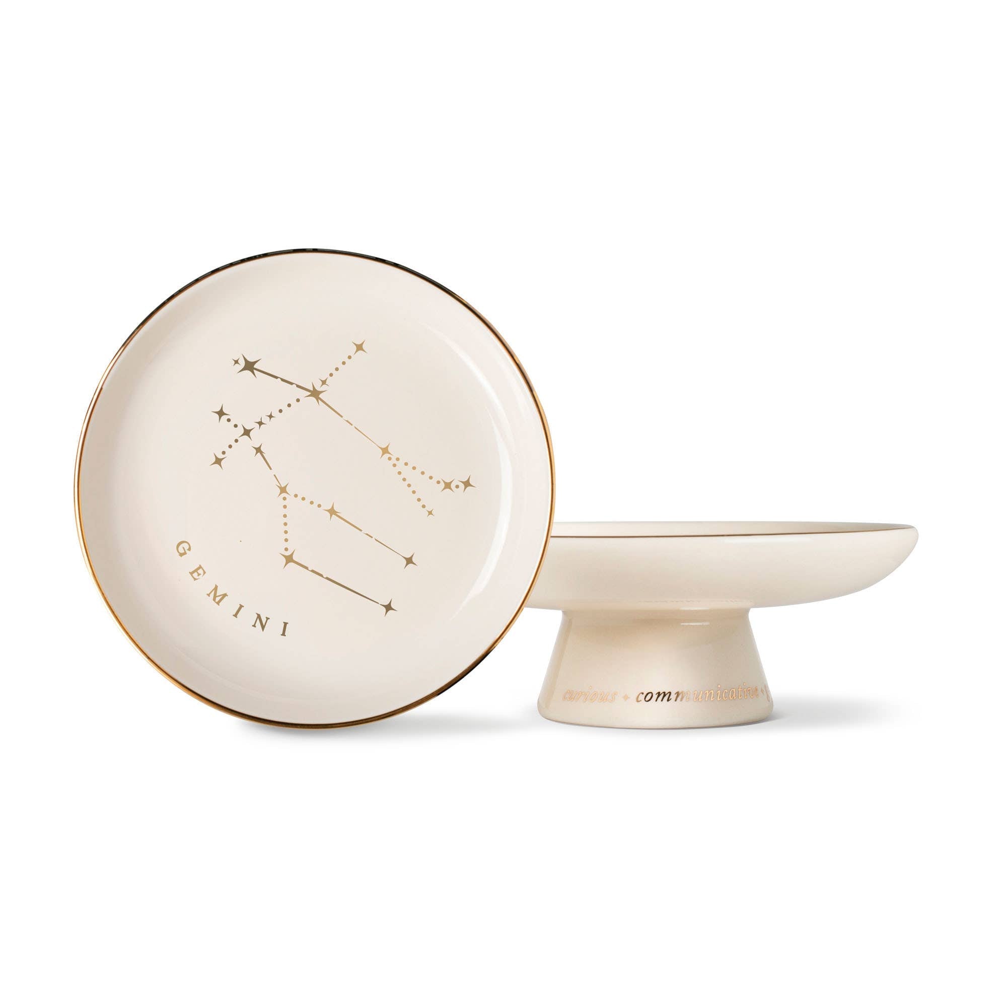 The Rooted Home Gemini Zodiac Pedestal Tray in stoneware with gold foil constellation and personality traits.