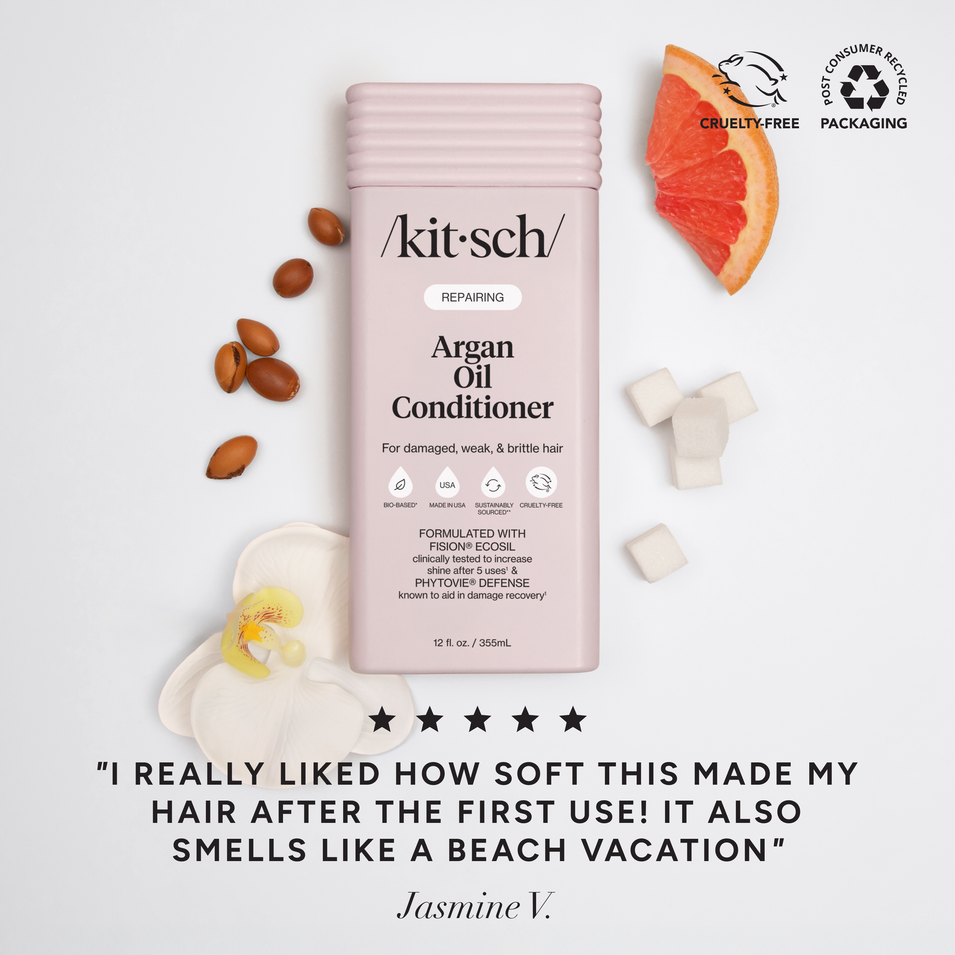 The Rooted Home Kitsch Argan Oil Repairing Conditioner bottle with argan nuts, grapefruit, and orchid flower accents.
