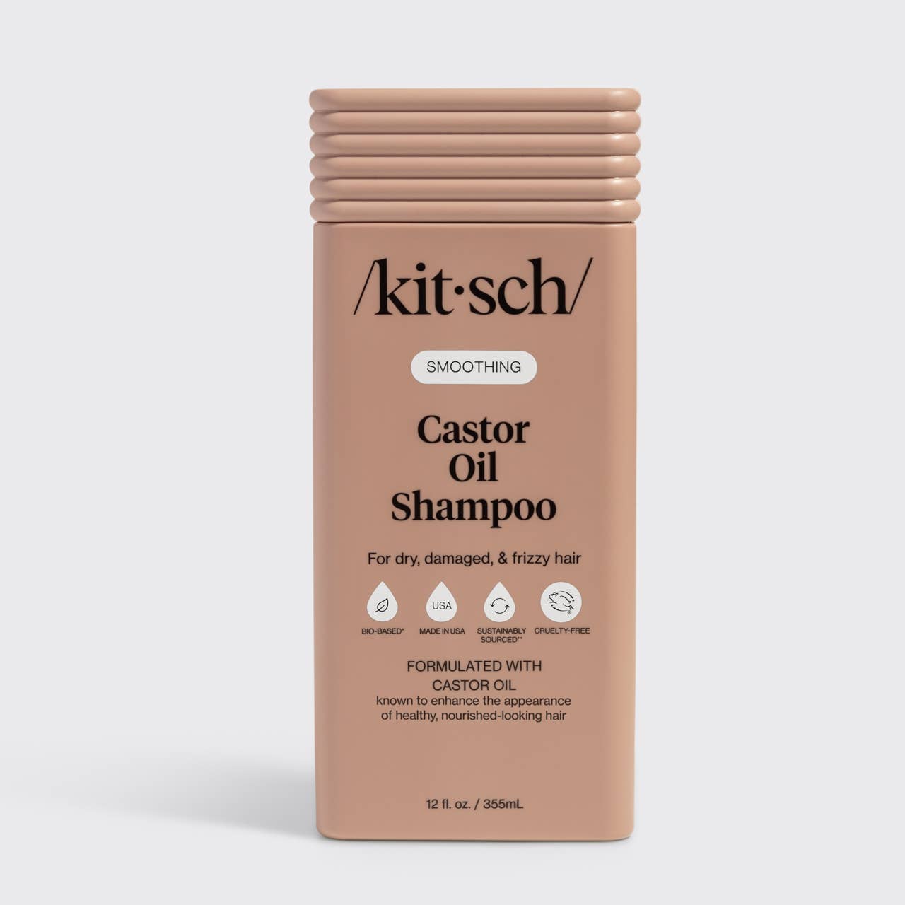 The Rooted Home Kitsch smoothing castor oil shampoo bottle for dry and frizzy hair in a tan sustainable container.