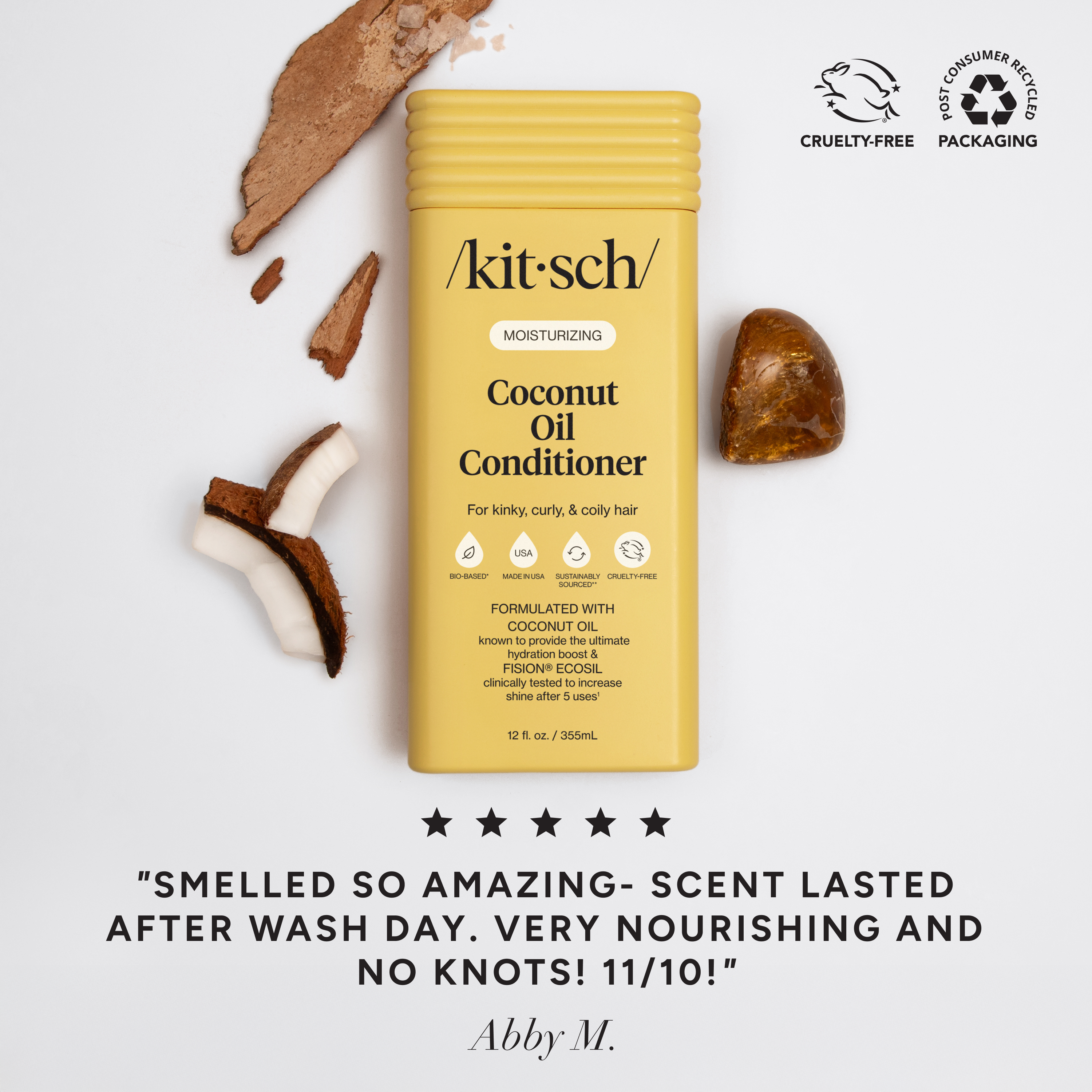 The Rooted Home Kitsch moisturizing coconut oil conditioner bottle in yellow packaging with coconut pieces and stone