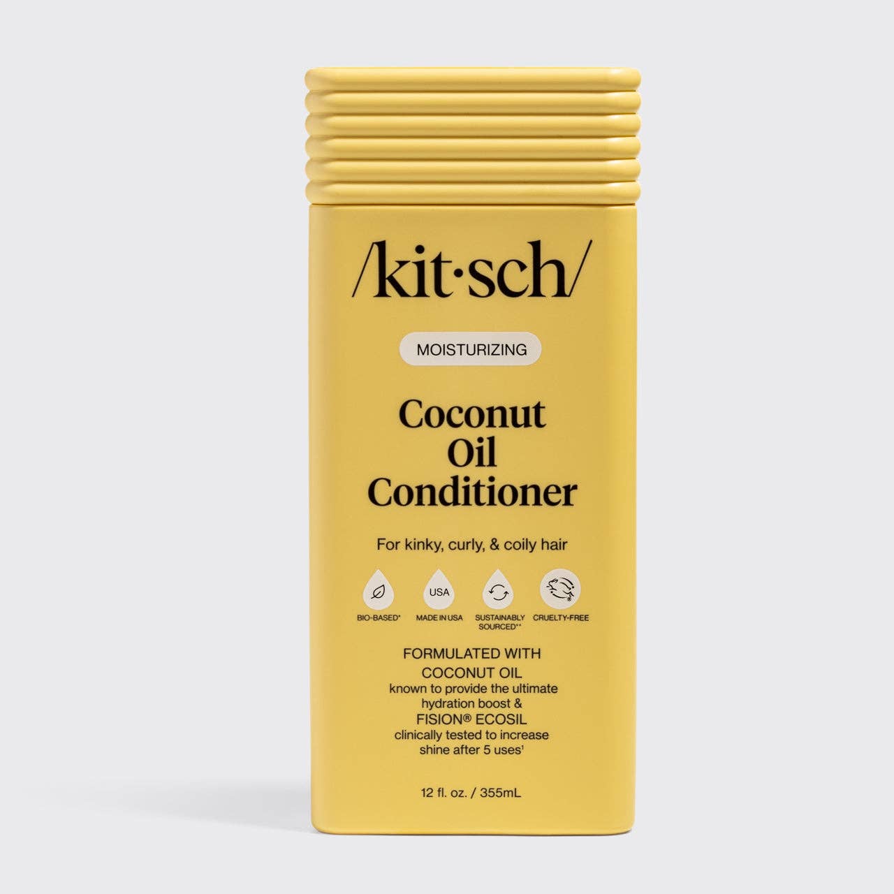 The Rooted Home Kitsch moisturizing coconut oil conditioner bottle for curly hair in yellow packaging