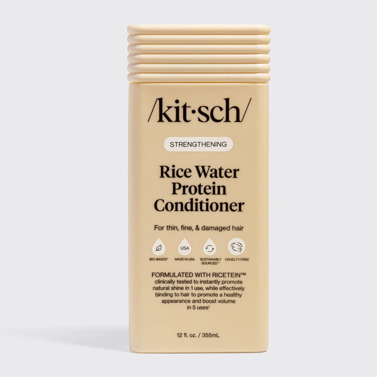 The Rooted Home Kitsch Strengthening Rice Water Protein Conditioner in a beige bottle for thin and damaged hair.