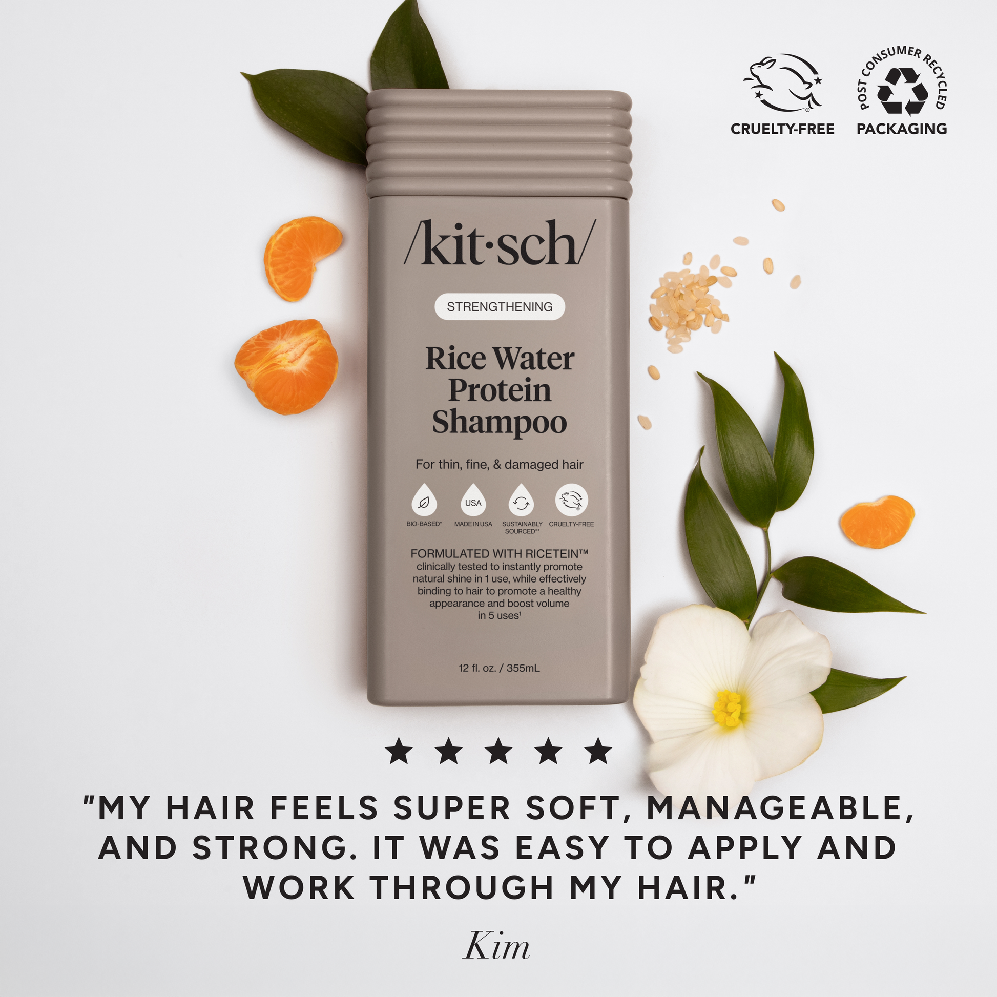 The Rooted Home Kitsch Strengthening Rice Water Protein Shampoo bottle with citrus slices and leaves on white background