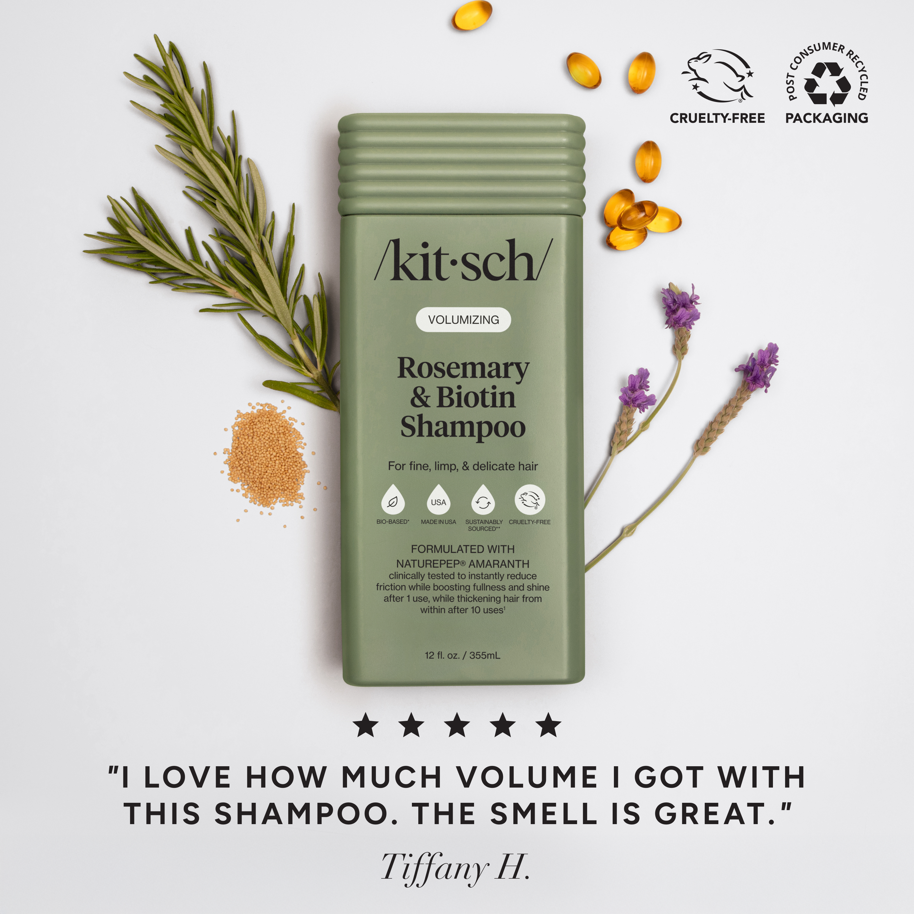 The Rooted Home Kitsch Volumizing Rosemary and Biotin Shampoo bottle with rosemary sprigs and lavender on white.