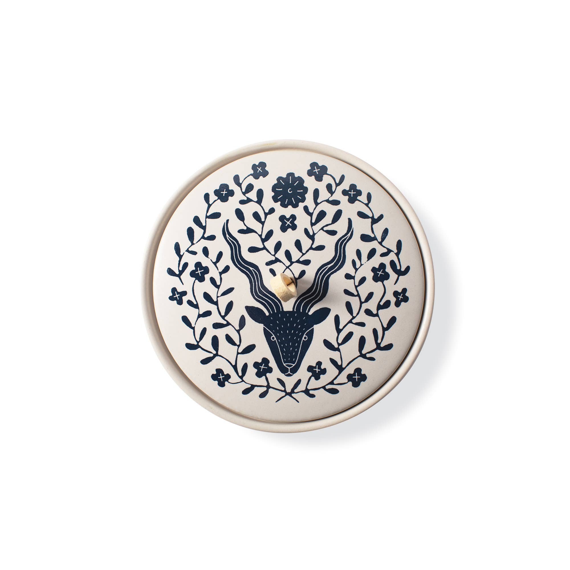 The Rooted Home Zodiac Ceramic Trinket Box with a cream matte finish, navy Capricorn goat design, and suede loop.