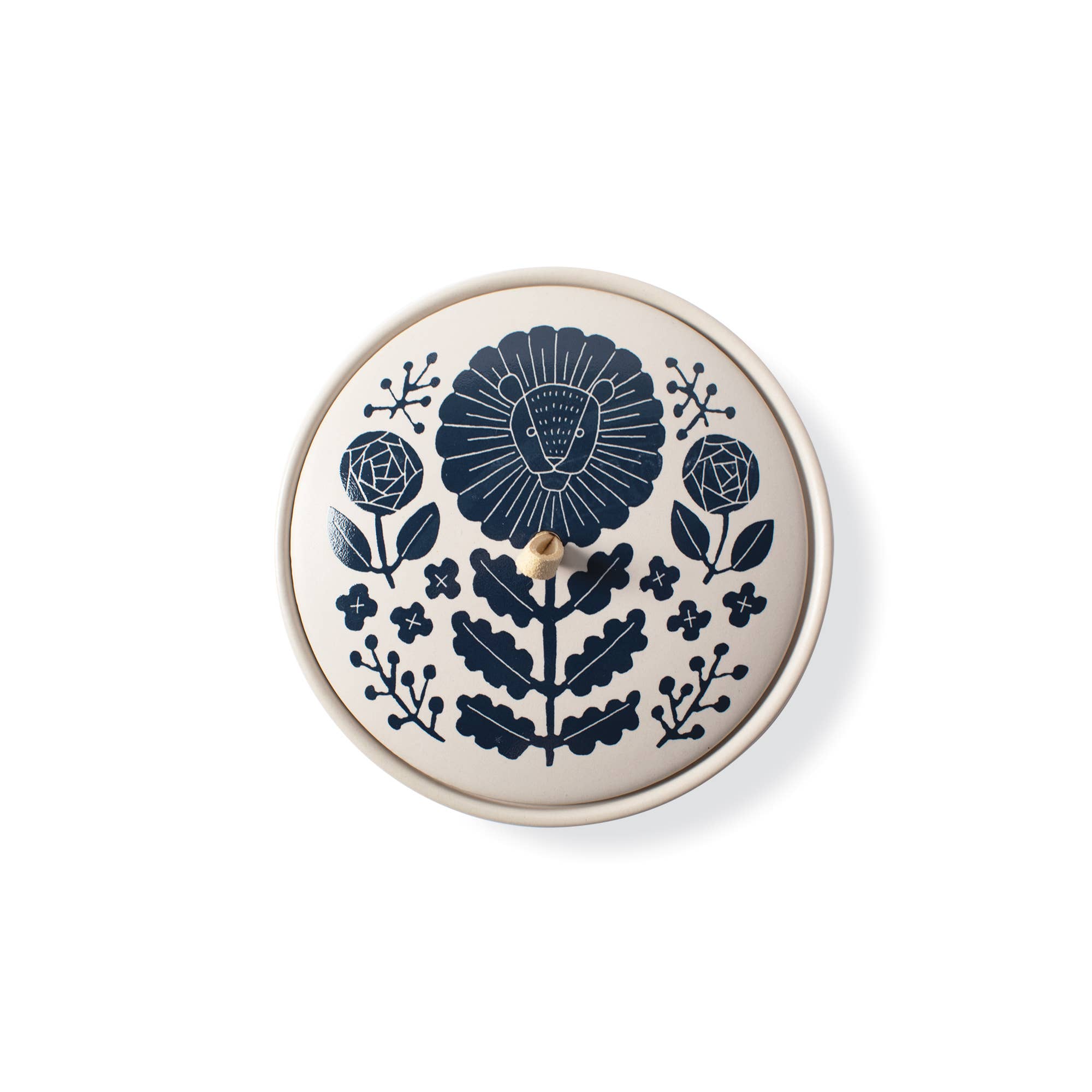 The Rooted Home round ceramic trinket box with a matte finish and a navy blue Leo zodiac floral illustration on lid.