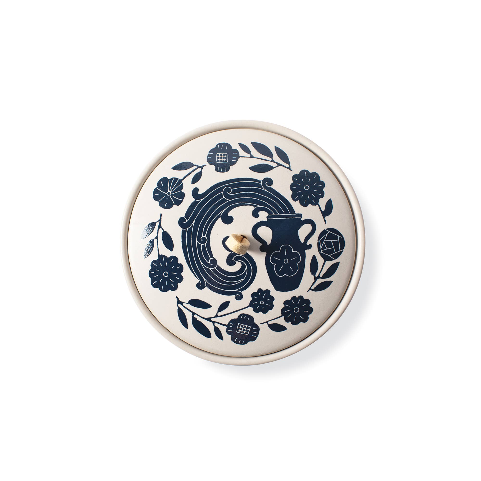 The Rooted Home Zodiac Ceramic Trinket Box with a matte cream finish, blue floral design, and faux suede loop handle.