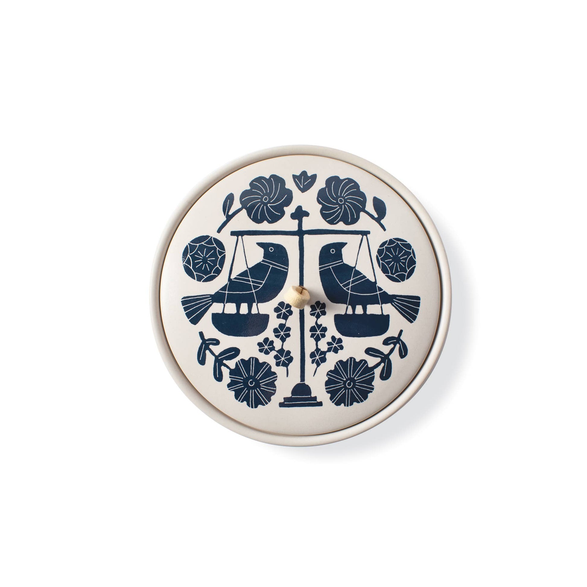 The Rooted Home Zodiac Ceramic Trinket Box featuring a Libra scale and floral design in blue on a matte cream lid.