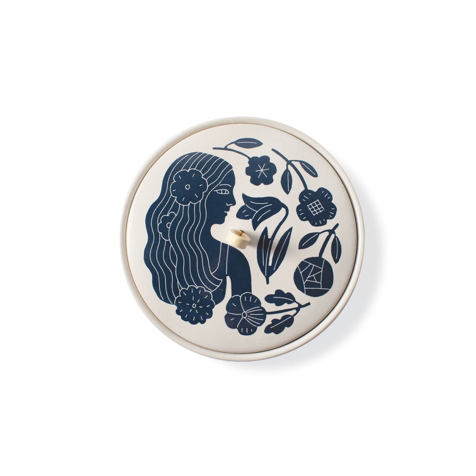 The Rooted Home ceramic trinket box with a matte finish, featuring a blue floral illustration and suede loop handle.