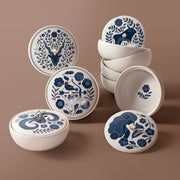 The Rooted Home ceramic zodiac trinket boxes with blue floral patterns, matte finish, and faux suede loop handles.